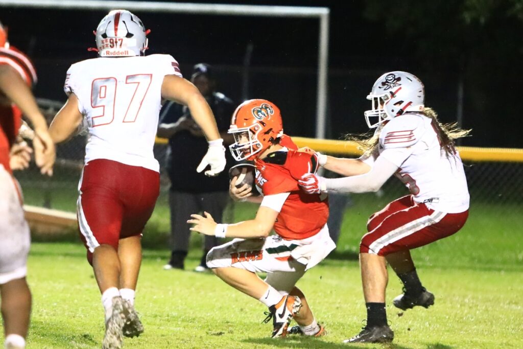 Santa Fe's Mason Nipper (45) sacks Eastside's Andrew Sutherland (12) late in the second quarter on Thursday. Photo by C.J. Gish