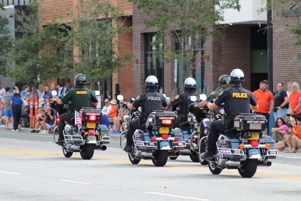 The Alachua County Sheriff's Office (ACSO) and Gainesville Police Department (GPD) in the UF Homecoming Parade. (Photo by Nick Anschultz)